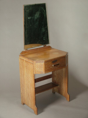 Appraisal: A limed oak dressing table the raised mirror back above