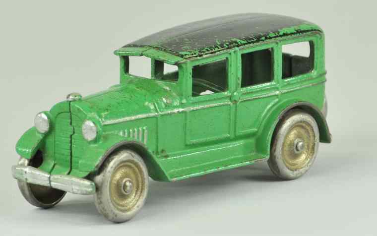 Appraisal: KENTON SEDAN Scarce size cast iron painted in green overall