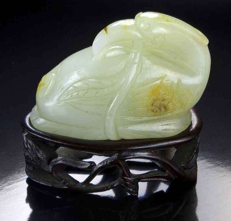 Appraisal: Chinese Liao Jin dynasty carved jade birdwith russet skin holding