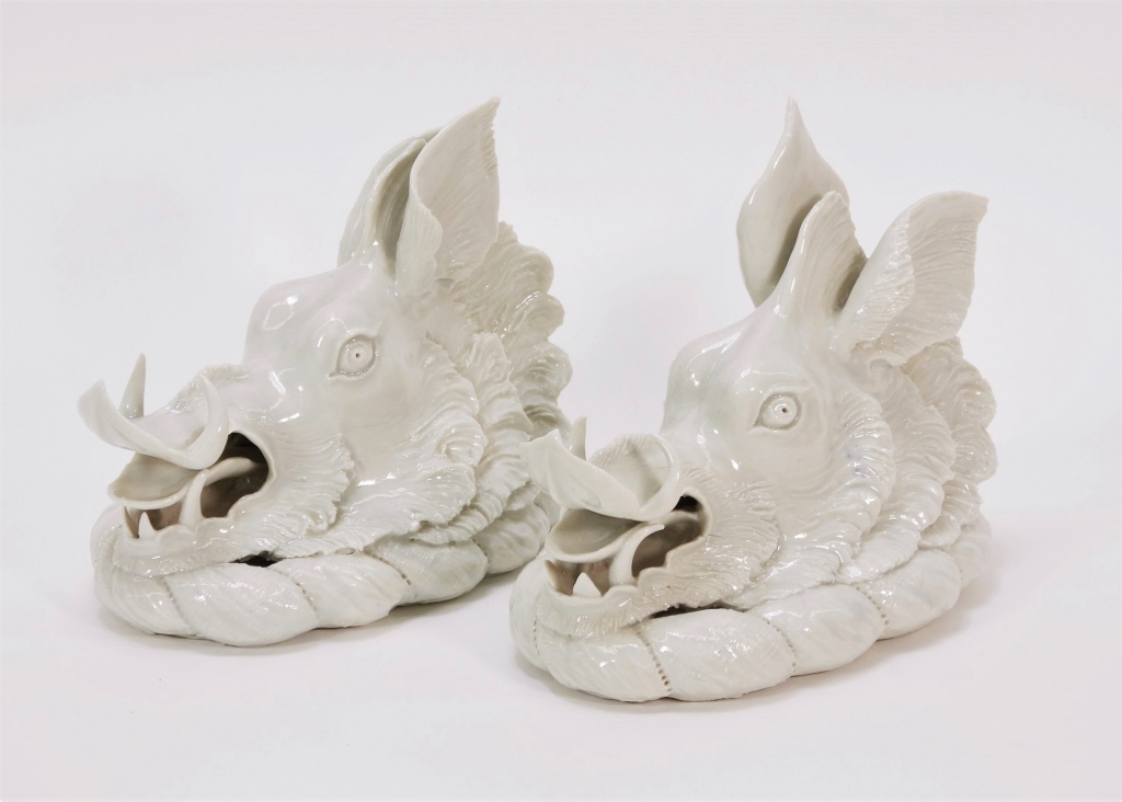 Appraisal: C EUROPEAN WHITE PORCELAIN BOAR HEAD SCULPTURES Europe th CenturyPair