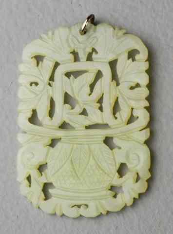 Appraisal: Chinese Carved Celedon Jade pendantFinely carved on both sides to