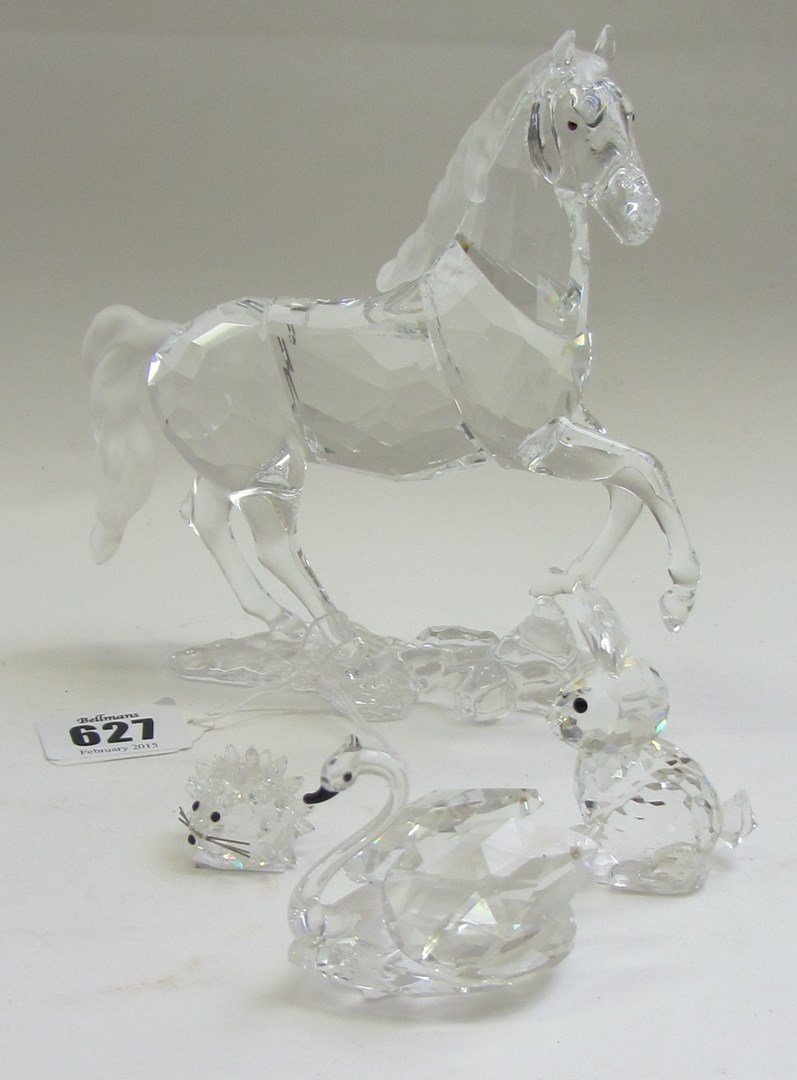 Appraisal: A Swarovski crystal horse boxed and with certificate together with