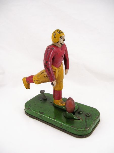 Appraisal: Mechanical Football Player Original paint and rubber football Typical age