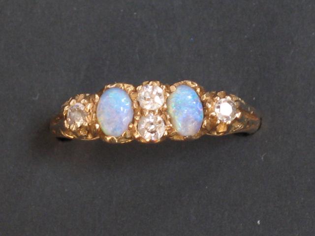 Appraisal: AN OPAL AND DIAMOND DRESS RING the two oval cabochon