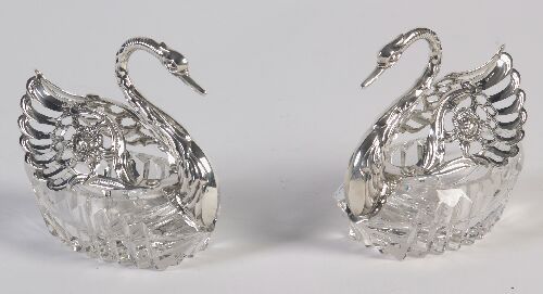 Appraisal: A pair of continental silver mounted cut crystal swans with