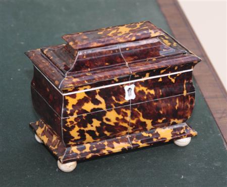 Appraisal: A George IV tortoiseshell tea caddy of rectangular bomb form