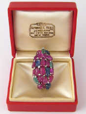 Appraisal: Raymond Yard A platinum diamond carved ruby sapphire and emerald