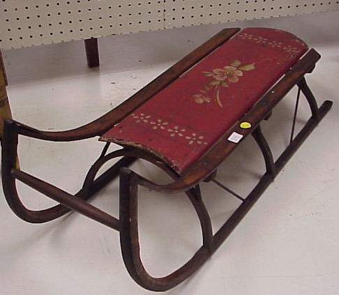 Appraisal: Child's wooden sled red painted and floral decorated with bentwood