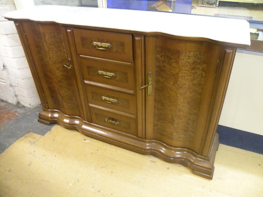 Appraisal: A Continental walnut and burr walnut veneered sideboard with a