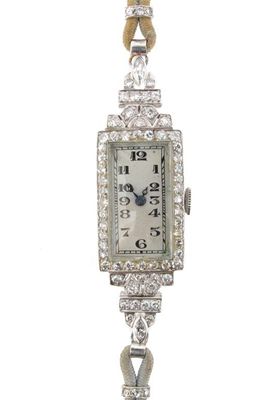 Appraisal: A lady's diamond set cocktail wristwatch Rectangular dial with black