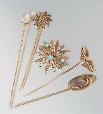 Appraisal: A Set of Victorian Stick Pins and a Brooch Containing