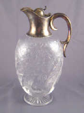 Appraisal: A late Victorian silver mounted glass claret jug with flying