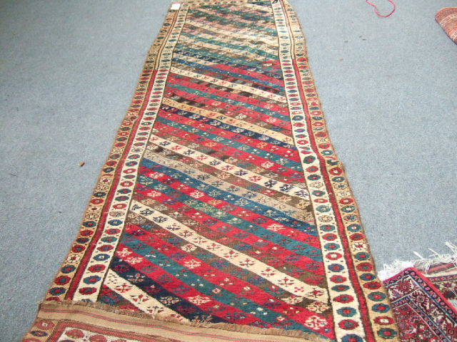 Appraisal: A Karajar runner the field with multi-coloured diagonal stripes twin