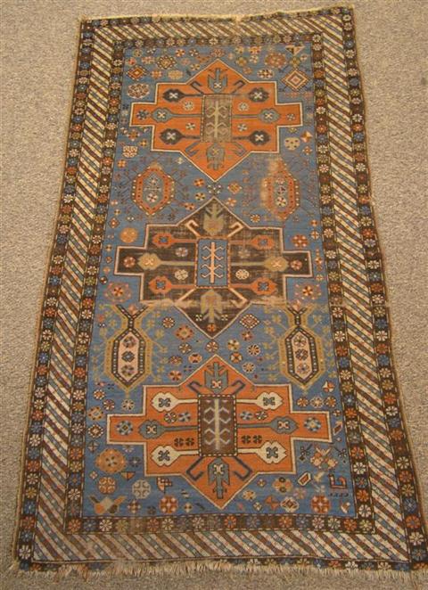 Appraisal: CAUCASIAN SHIRVAN RUG AND PERSIAN BEIGE GROUND RUNNER the Caucasian