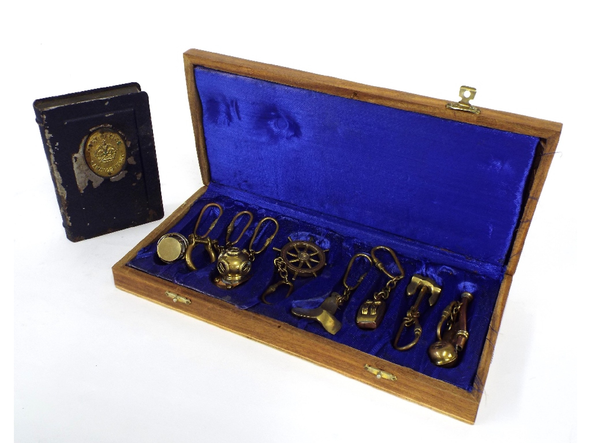 Appraisal: Interesting cased set of eight brass and copper charms of