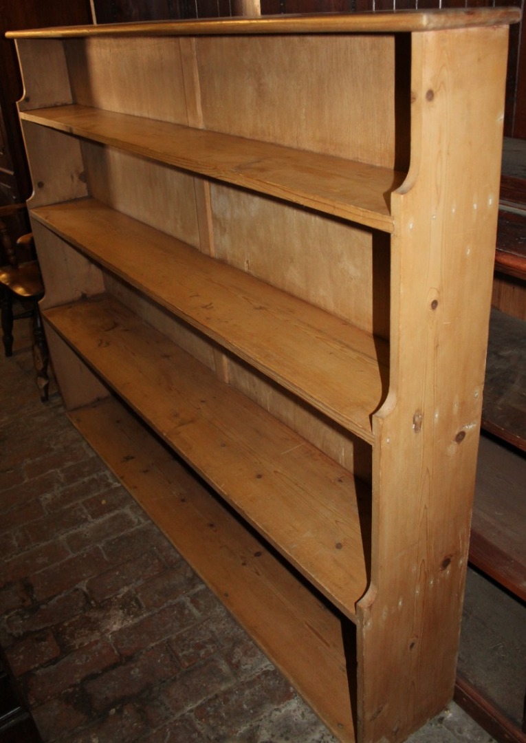 Appraisal: A stripped and lightly polished pine freestanding bookcase with plain