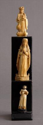 Appraisal: THREE CONTINENTAL SMALL CARVED IVORY FIGURES The largest the Madonna