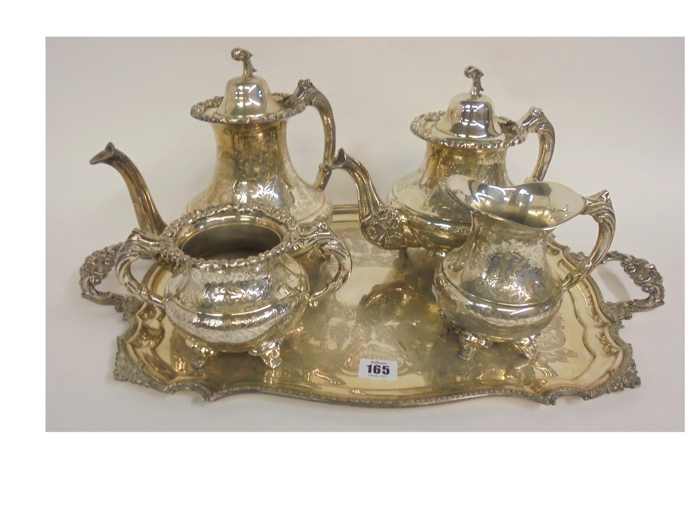 Appraisal: A heavy reproduction early Victorian style electroplate four piece tea