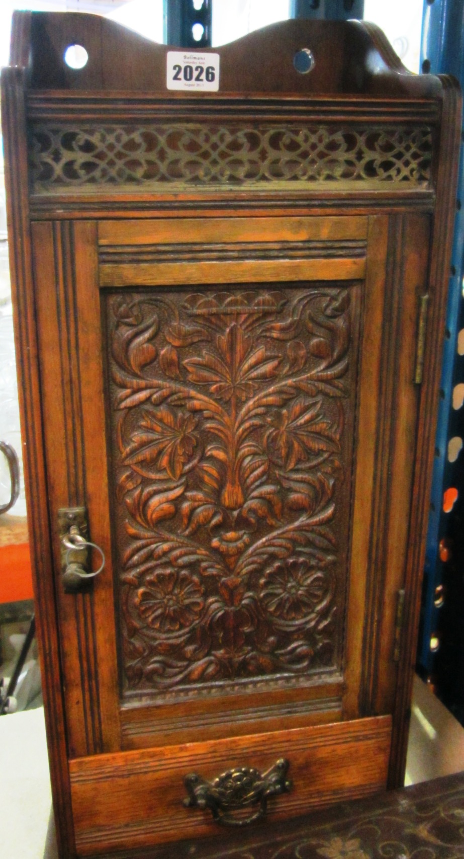 Appraisal: A th century walnut smokers cabinet