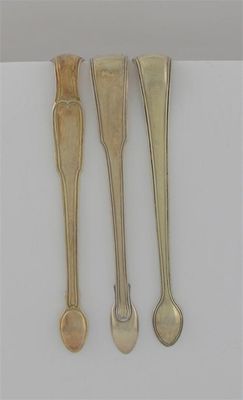 Appraisal: Three various pairs of George III silvergilt thread pattern sugar