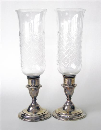 Appraisal: Pair of sterling silver weighted base consoles th century