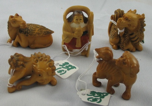 Appraisal: FIVE CARVED AND MOLDED NETSUKE made from a composite resembling