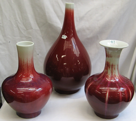 Appraisal: THREE GLAZED CHINESE VASES various bottle-forms each in a plum