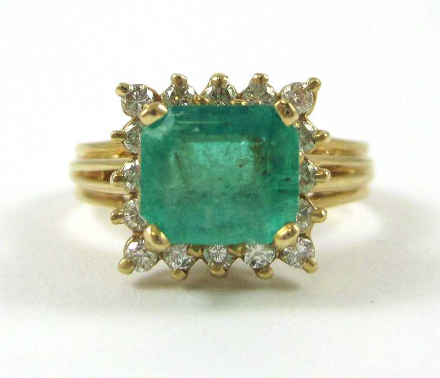 Appraisal: EMERALD DIAMOND AND FOURTEEN KARAT GOLD RING with round-cut diamonds