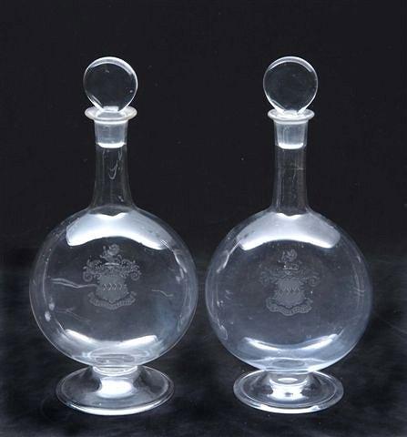 Appraisal: A PAIR OF ENGLISH GLASS FLASKS with stoppers and engraved