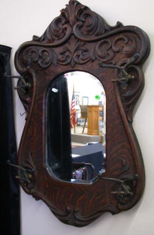 Appraisal: Golden Oak era wall hat rack mirror with applied carvings