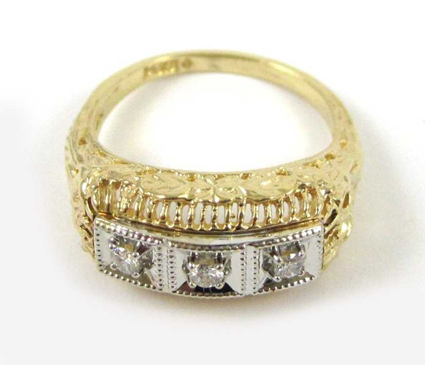 Appraisal: DIAMOND AND FOURTEEN KARAT GOLD RING The yellow and white