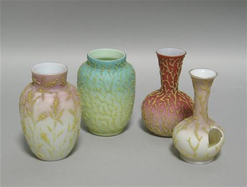 Appraisal: FOUR CORALENE SMALL VASES Including one pink with applied grasses