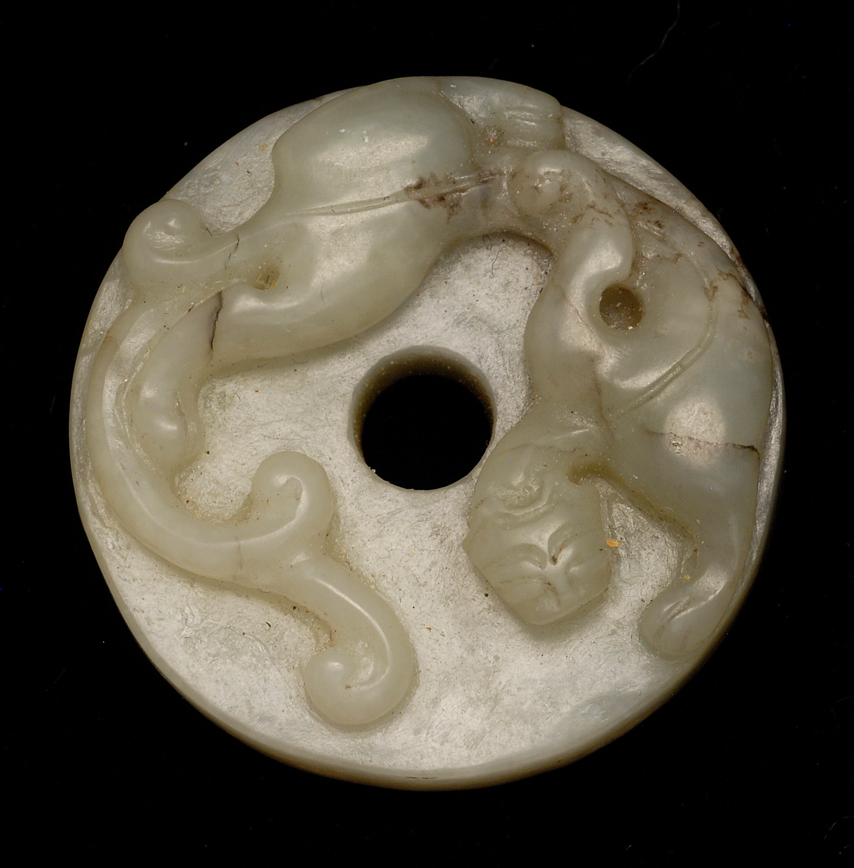 Appraisal: GRAY AND BLACK JADE BI th CenturyWith relief dragon carving