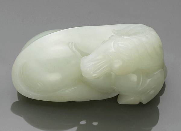 Appraisal: A white jade model of a horse Shown in a