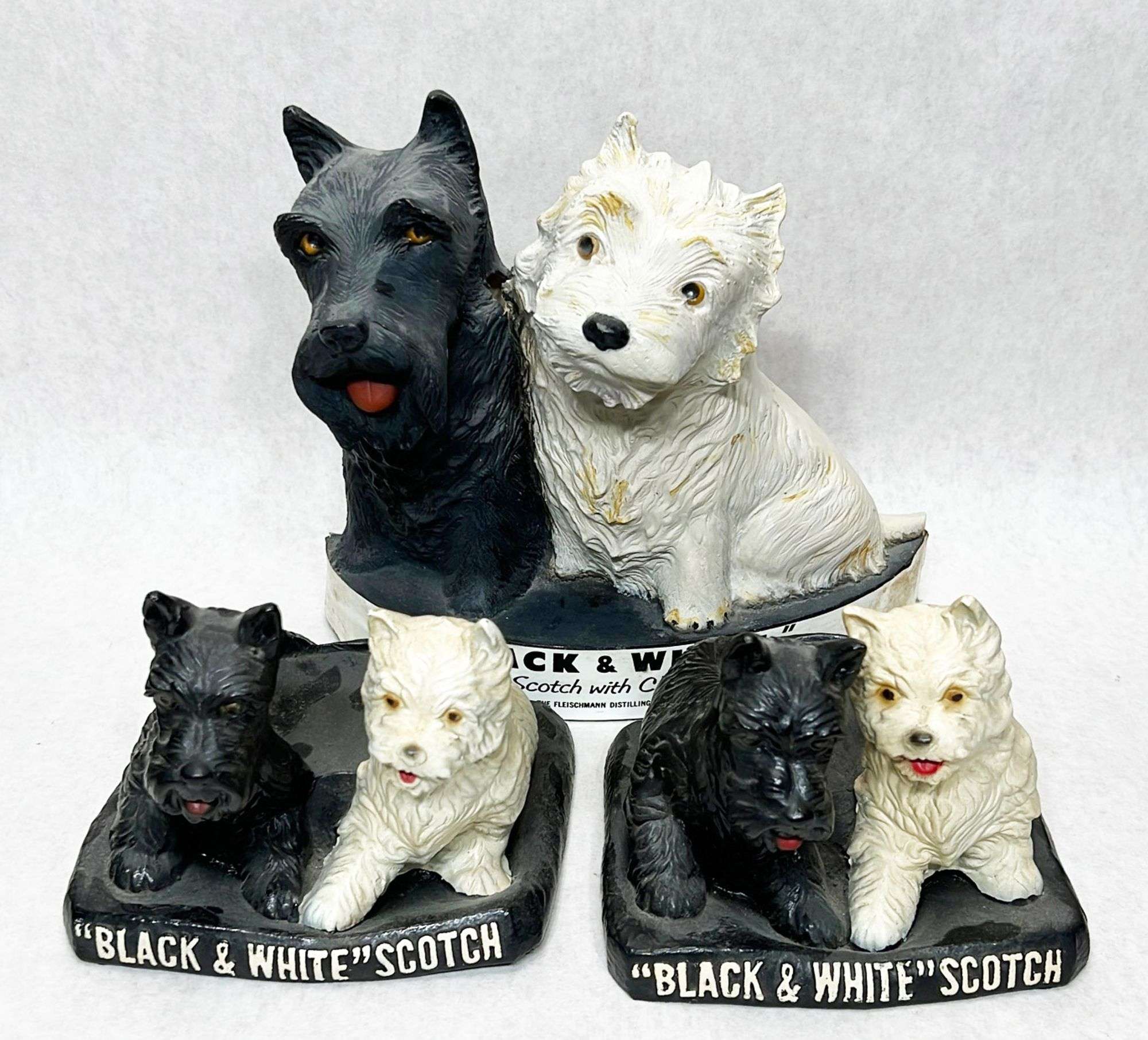 Appraisal: Black And White Scotch Whiskey Scotty Dog Advertising Piecestallest Condition