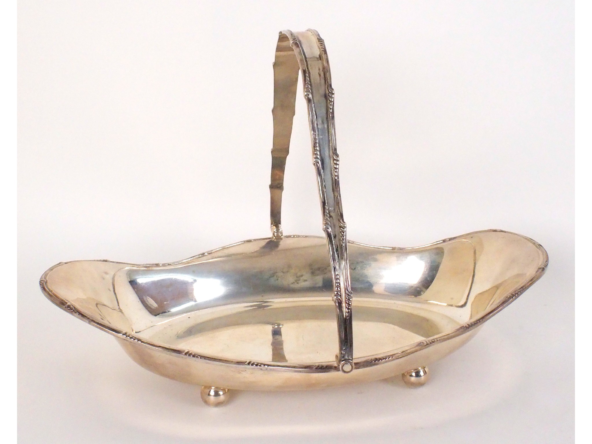 Appraisal: A silver swing handled basketby R F Mosley Company Sheffield