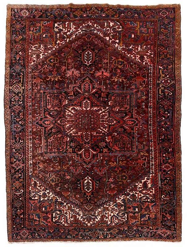 Appraisal: Heriz Carpet central diamond and rectangular medallion red field stepped