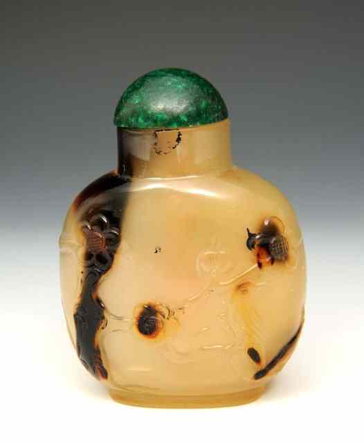 Appraisal: A CHINESE PALE BROWN CHALCEDONY CHINESE SNUFF BOTTLE of rounded