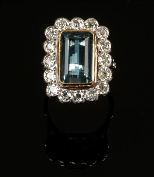 Appraisal: A aquamarine and diamond ring centring on a step cut