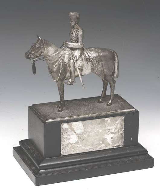 Appraisal: A SILVER MODEL OF A MILITARY HORSEMAN on raised pedestal