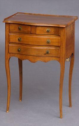 Appraisal: LOUIS XV PROVINCIAL FRUITWOOD TABLE EN CHIFFONIERE The serpentine-fronted top