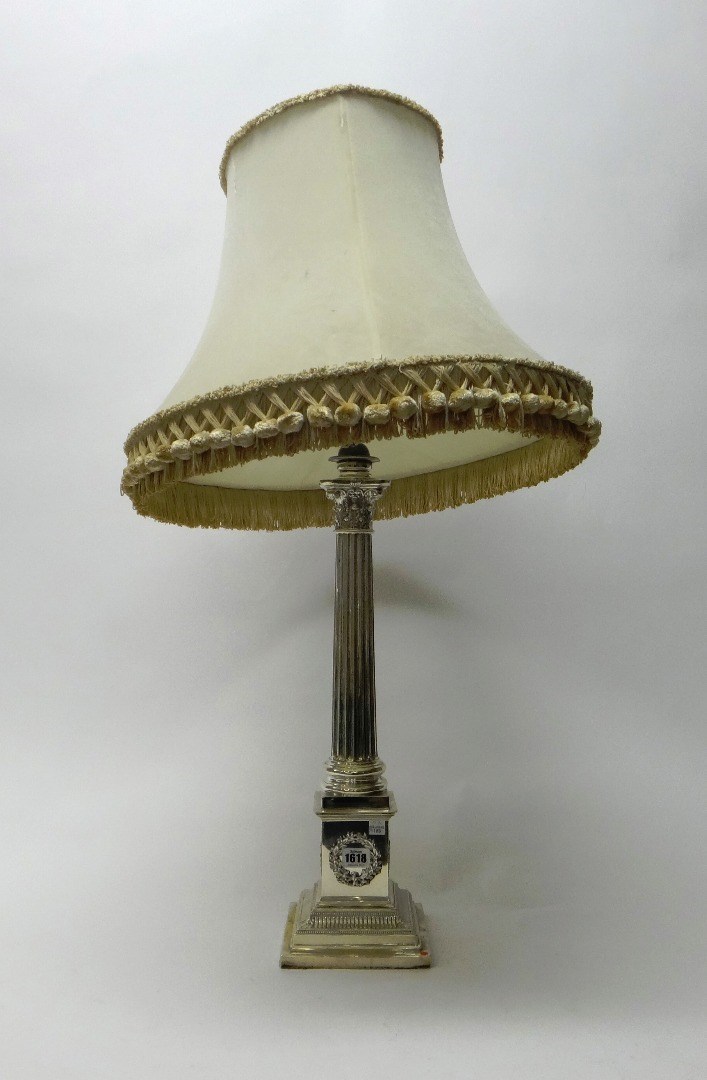 Appraisal: A large silver table lamp formed as Corinthian column on