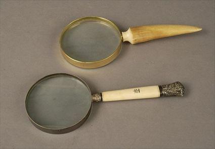 Appraisal: Two Ivory-Handled Magnifying Glasses Each approx in Provenance The Estate