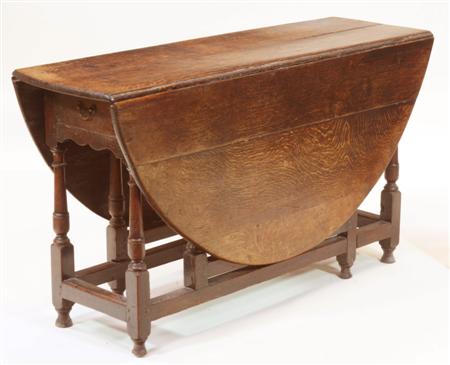 Appraisal: An early th century oak drop leaf table the moulded