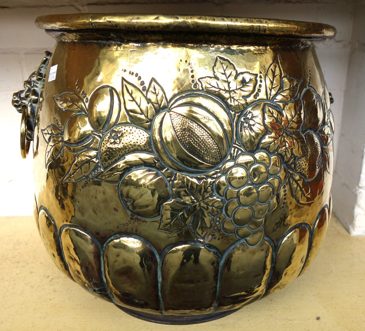 Appraisal: An embossed brass coal bin early th century embossed with