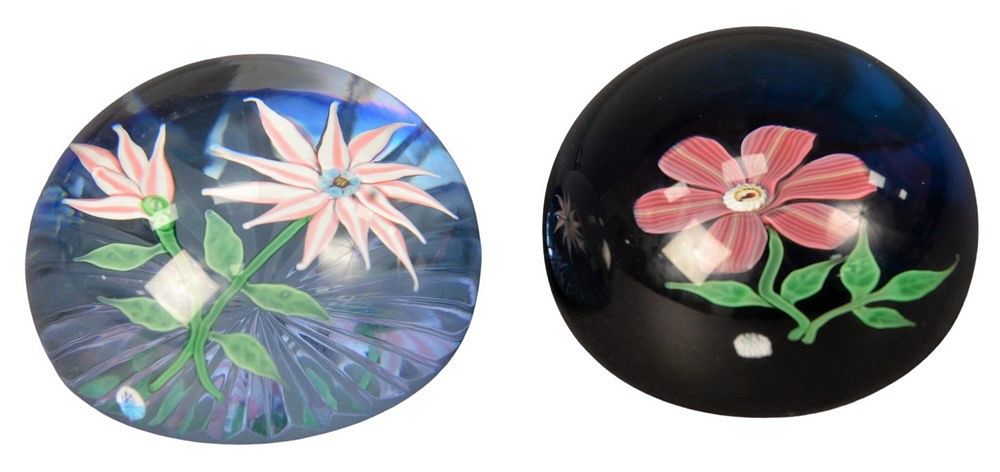 Appraisal: Two Baccarat Glass Paperweights having floral interiors of pink and