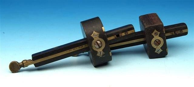 Appraisal: A Victorian ebony and brass mounted cabinet makers mortice gauge