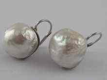 Appraisal: A pair of white metal tests carat gold mabe pearl