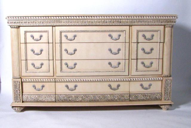 Appraisal: Neo-classical triple dresser combining French and Mediterranian styles carved molded