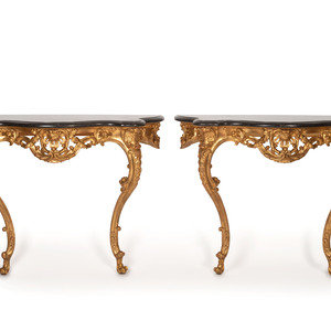 Appraisal: A Pair of Rococo Style Giltwood Marble Top Console Tables